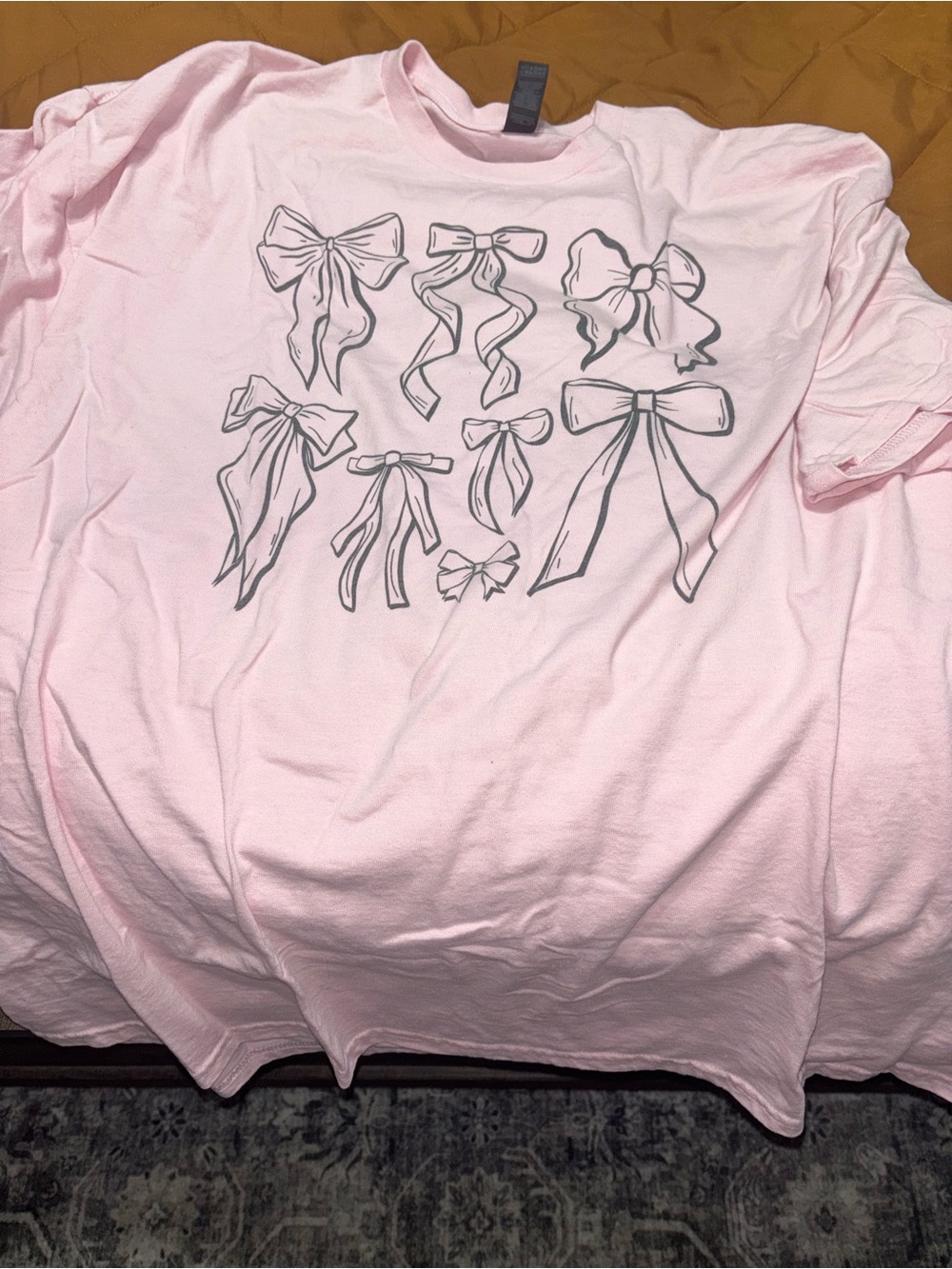 Bella Canvas Light Pink Short Sleeve Tee with Black Bow Graphics
